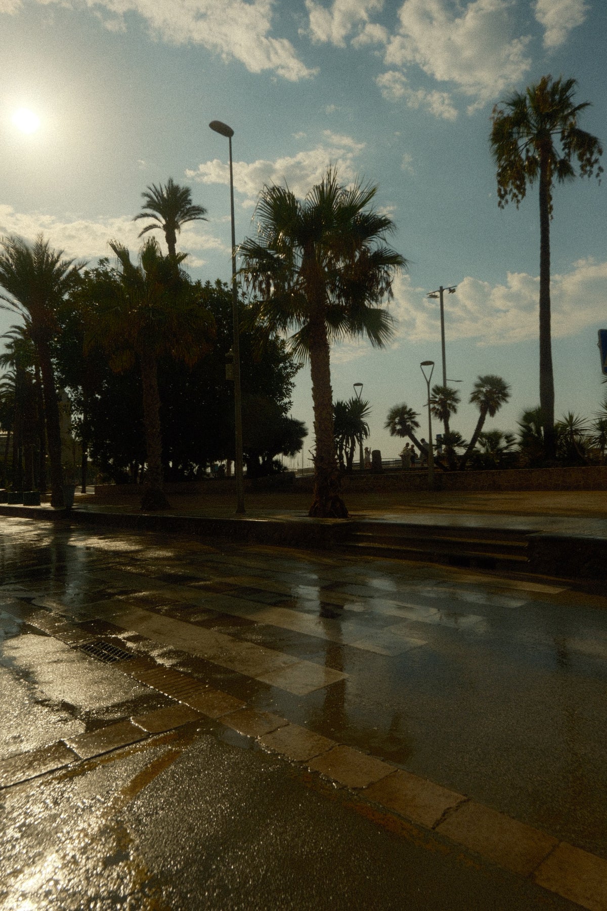 Wet walkway in Sitges, Spain after a short downpour