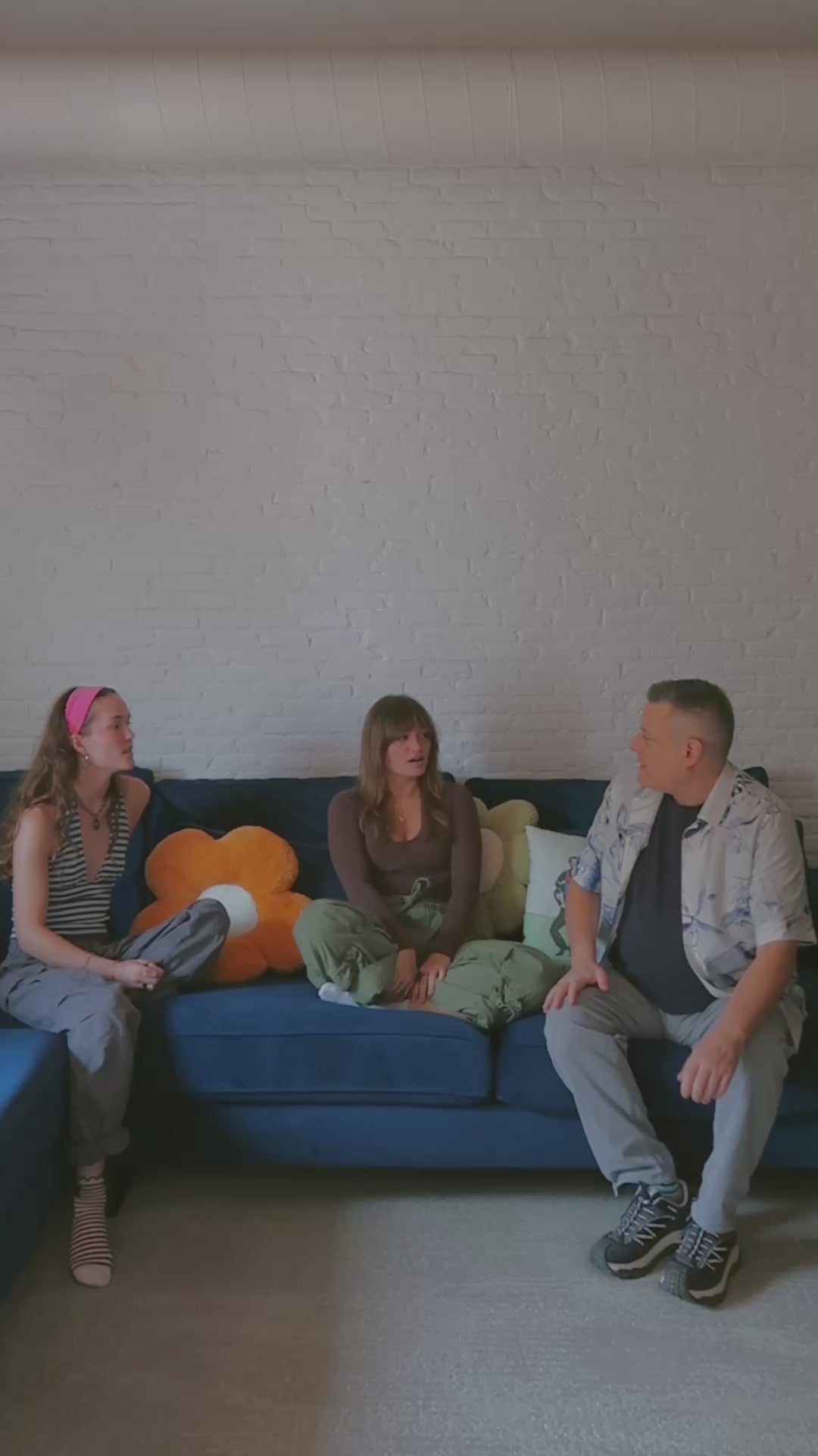 The Mailbox Drop team introducing themselves in a casual conversation on a sofa.